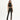 A model poses in a fitted black crop top and high-waisted pants with side slits, complemented by strappy heels.
