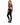 A model poses in a fitted long-sleeve top with a cutout design, paired with black skinny jeans and sneakers.
