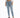 A person wearing light blue high-waisted jeans and gray fuzzy slides, standing against a plain white background.