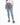A person wearing light blue high-waisted jeans and gray fuzzy slides, standing against a plain white background.