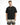 A man stands wearing a black oversized t-shirt with white text, paired with light ombre shorts.