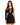 A model poses in a black, form-fitting dress featuring a cutout design and one long sleeve.