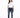 A woman stands confidently in a white t-shirt and distressed blue jeans, paired with white sneakers.