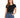 A woman wearing a black t-shirt and high-waisted blue jeans, accessorized with a black belt and watch.