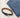 A black belt with a silver buckle placed beside folded blue denim jeans on a light fabric surface.