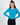 Model wearing the Goldie Top, a blue long-sleeve ribbed knit top with a shoulder cutout and crew neckline.