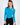 Model wearing the Goldie Top, a bright blue long sleeve ribbed knit top with a shoulder cutout and crew neckline.