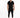 A man stands confidently in a black short-sleeve overall with tapered legs and stylish sneakers.
