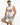 A man sits on a stool wearing a sleeveless white shirt with colorful graphic text and distressed gray shorts.