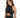 A woman in a sparkly black halter top with a cutout design, showcasing a stylish and modern look.
