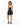 A woman stands in a black, sparkly dress with a ruffled hem, showcasing a halter neck and high-heeled sandals.