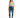 A woman stands confidently in a light green crop top, distressed blue jeans, and white sneakers with neon accents.