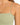Close-up of a light green ribbed top featuring thin straps and a square neckline, highlighting the fabric texture.