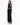 A woman poses in a fitted black dress with long sleeves and cut-out details, showcasing a sleek silhouette.