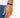 A close-up of a hand wearing a minimalist black bracelet with a sleek clasp, set against a light background.