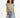Model in Gravity Grey Padded Muscle Tee with structured shoulders and distressed denim shorts against white background.