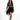 Model in Harlow black mini fringe skirt with a tan patterned long-sleeve top and heels against a white background.