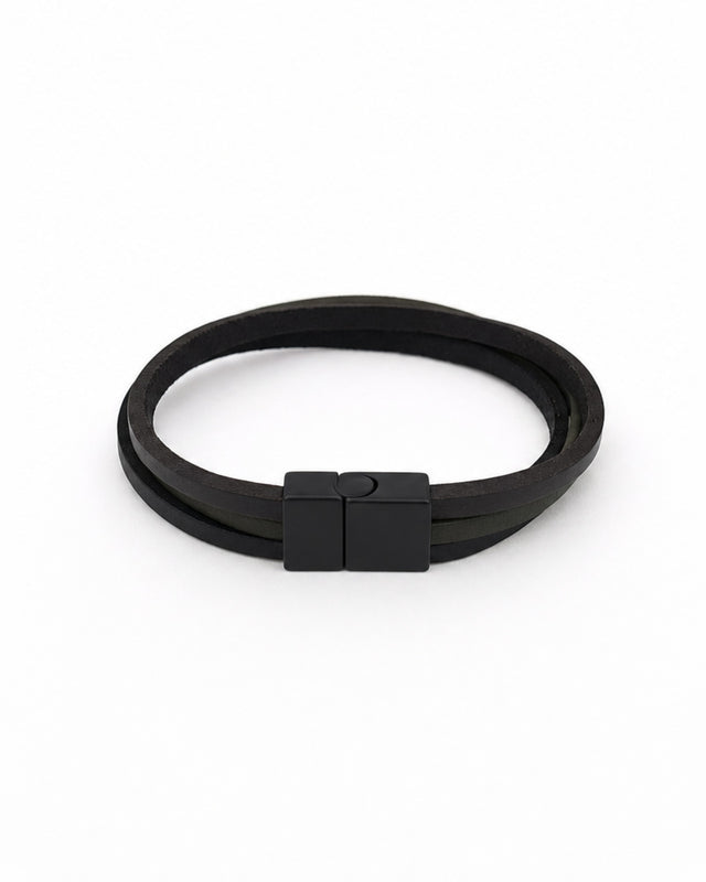 Black bracelet with a sleek magnetic clasp, featuring layered strands for a modern look.