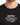 Black t-shirt featuring bold white text with a magical theme, showcasing a popular wizarding world design.