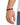 A close-up of a hand wearing a black beaded bracelet with geometric accents, showcasing a stylish accessory.