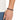 A close-up of a hand wearing a dark beaded bracelet, showcasing a casual style against a light shirt.