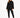 A woman stands confidently in a black, oversized sweatshirt paired with matching joggers and white sneakers.