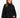 A woman with long hair wears a black, oversized sweatshirt with a high neckline and wide sleeves.