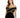 A woman models a fitted black dress with off-the-shoulder sleeves and intricate gold detailing.