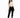 A model poses in a fitted beige long-sleeve top with cut-out details, paired with black skinny jeans and sneakers.