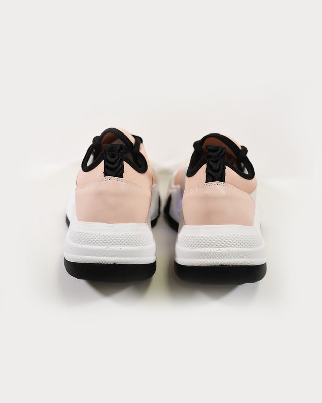 Heel view of Ice Chunky Platform Sneakers in blush pink and white with black trim and streetwear soles.