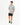Model in the Popit Grey Oversized Shirt with white chest text, black streetwear shorts, and black sneakers.