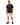 A man stands confidently in a black t-shirt with a white graphic, paired with beige cargo shorts and black sneakers.