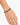 A close-up of a hand wearing a beaded bracelet featuring deep blue and gold accents.