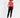 Model in a red off-the-shoulder long sleeve top paired with black joggers and white high-top sneakers.