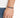 A hand wearing a colorful bead bracelet on a black cord, set against a light background.