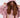A young woman with long, wavy hair wears a pink oversized hoodie and matching outfit, showcasing a stylish cutout des...