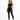 A model poses in a sleek black one-shoulder activewear top paired with matching leggings and sneakers.