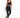 A model poses in a sleek black one-shoulder activewear top paired with matching leggings and black sneakers.