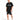 A man stands wearing a black oversized t-shirt with graphic text, paired with black shorts featuring a white number.