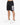 Black athletic shorts with a large white number graphic, paired with white sneakers and a casual fit.