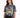 A woman wearing a tie-dye t-shirt featuring a bold tiger graphic, paired with black jeans.