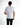 A person wearing a fitted white short-sleeve shirt, viewed from the back, paired with black pants.