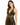 A woman models a black dress with gold stripes, featuring a deep V-neck and fitted silhouette.
