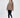 Brown oversized San Francisco California embroidered sweatshirt worn with black leggings and white sneakers.