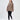 Brown oversized San Francisco California embroidered sweatshirt worn with black leggings and white sneakers.