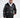 Man in Jerry Puffer Coat, a black insulated jacket with fur collar, worn over a white hoodie for winter street style.