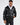 Man in Jerry Puffer Coat, a black insulated jacket with fur collar, worn over a white hoodie for winter street style.