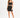 A model poses in a fitted black skirt and matching crop top, complemented by strappy black heels.