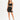 A model poses in a fitted black skirt and matching crop top, complemented by strappy black heels.