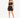 A woman poses in a black crop top and matching mini skirt, showcasing a stylish, fitted look with strappy heels.